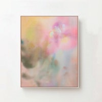 a pink and yellow abstract painting hanging on a wall