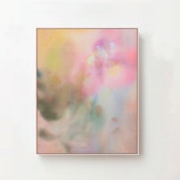 a pink and yellow abstract painting hanging on a wall
